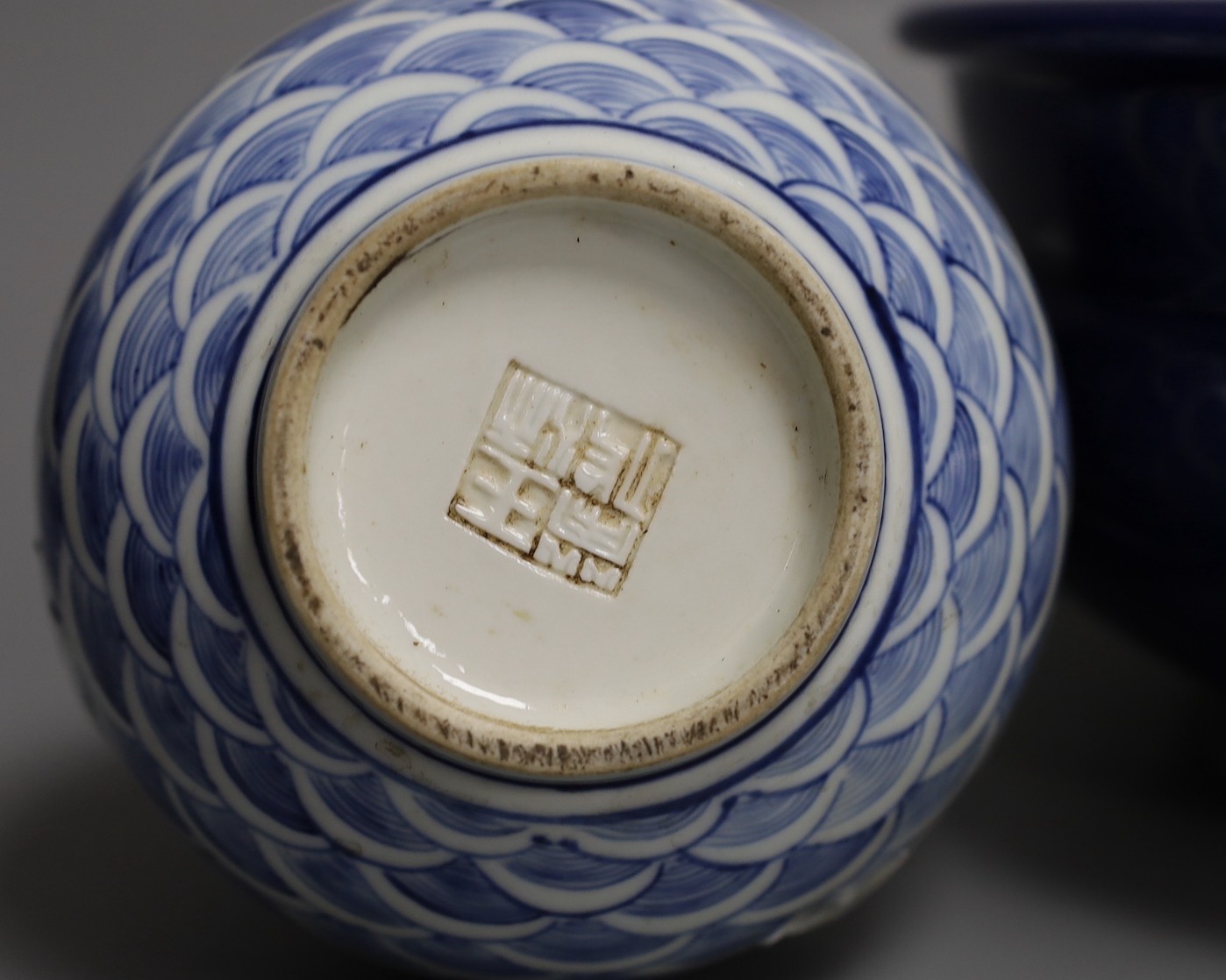 A Chinese blue and white ‘dragon’ bottle vase and a large blue glazed censer, diameter 23cm